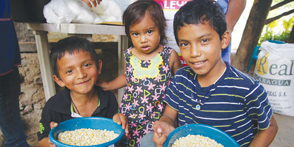 children holding bowls of food